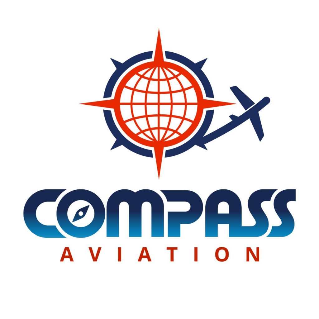 A diverse group of aviation professionals discussing strategies in a classroom setting at Compass Aviation.