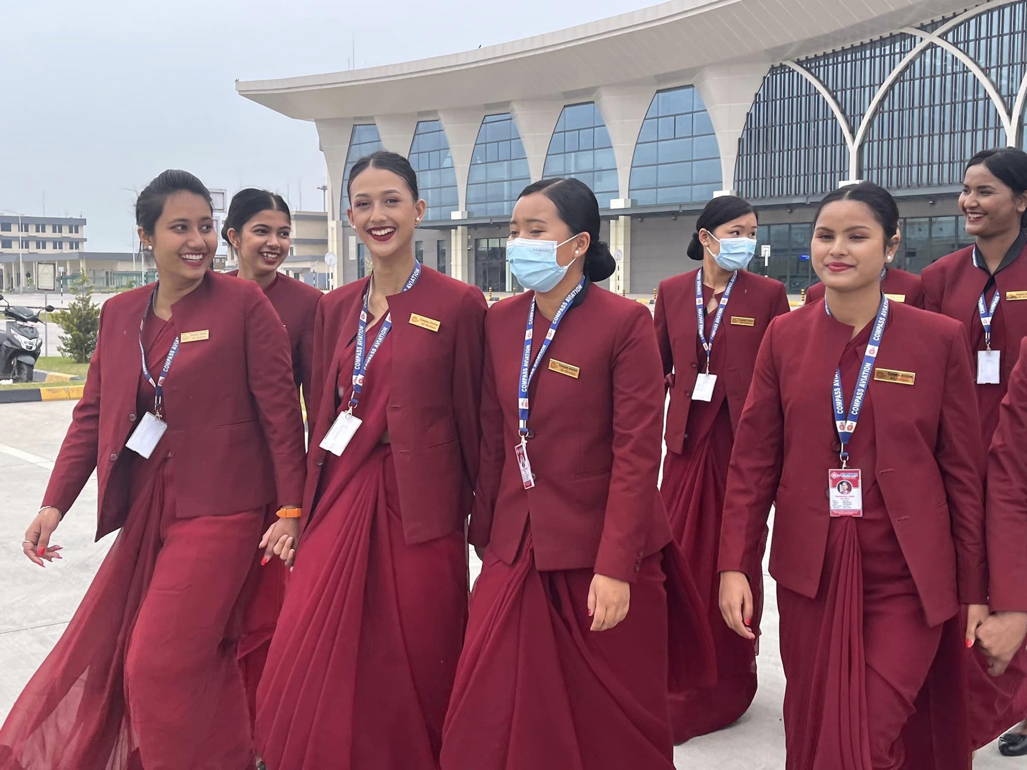 Air hostess assisting passengers with a friendly smile