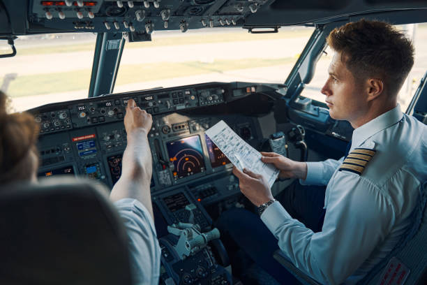Pilots and flight attendants working together in the cockpit and cabin of an aircraft.